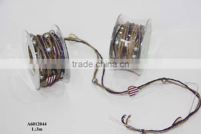 brown fabric ribbon with red balls