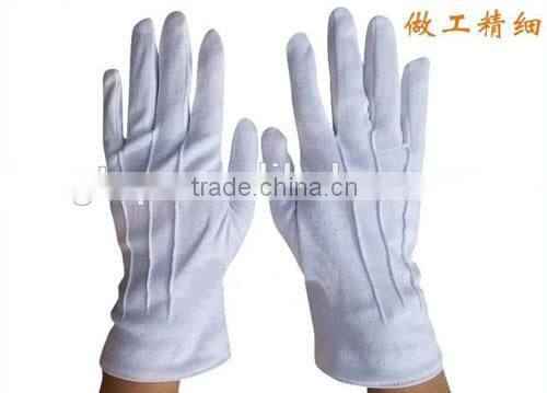 white cotton hand gloves