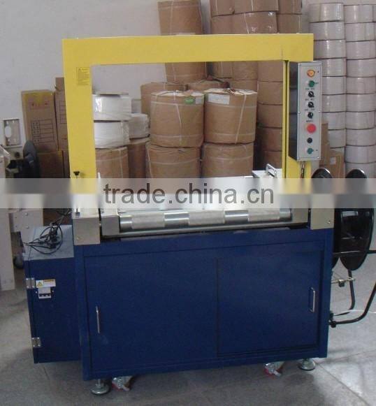 Full-automatic high table carton packing/strapping machine