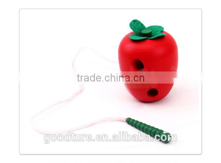 Wooden Caterpillar Eating Red Apple