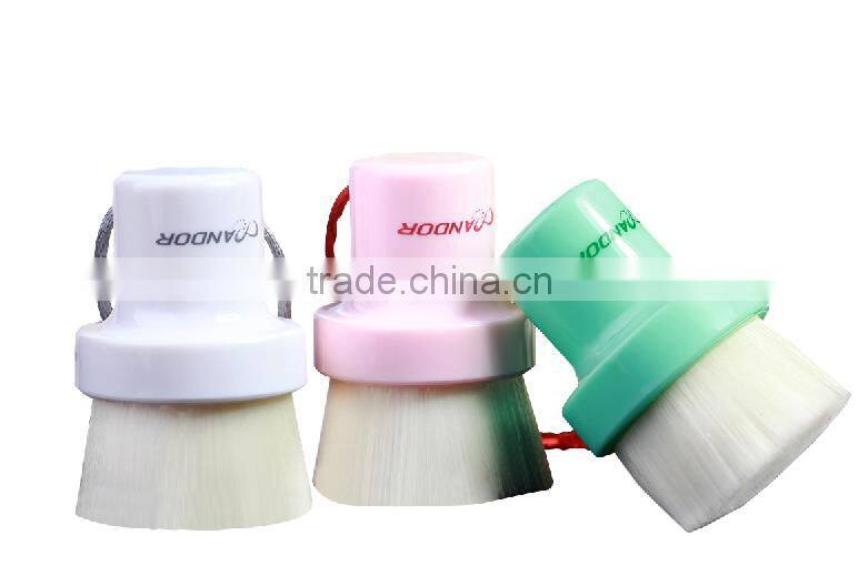 Facial cleansing brush with handle