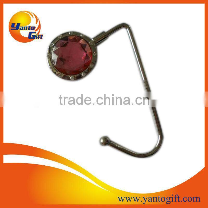 Foldable metal bag hanger