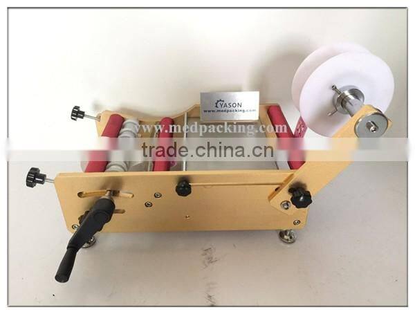Hand Labelling Machine Pet Bottle Labeling Machine Round Jar or Cylinder Labeling