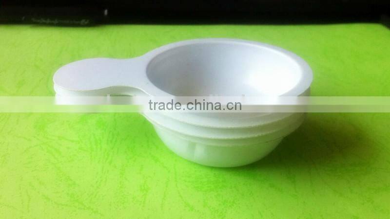 white disposable plastic tray for urine testing.