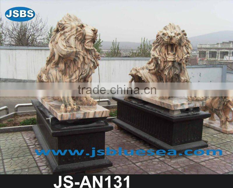 Red marble lion statue with wing
