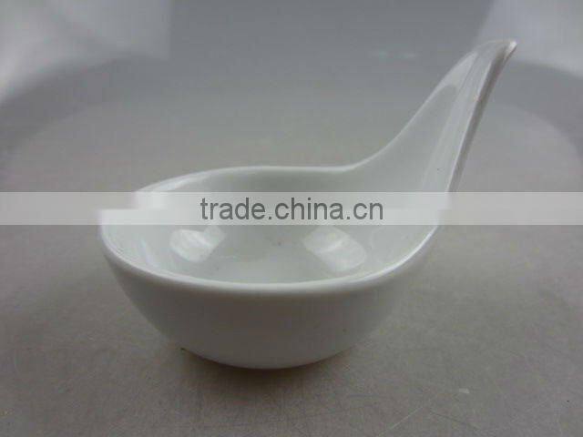 Stock white porcelain spoon shaped sauce dish