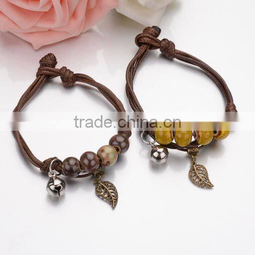 Small bell and leaf charms double layers cord bracelets lucky love couple leaf charm bracelets jewelry wholesale 2017