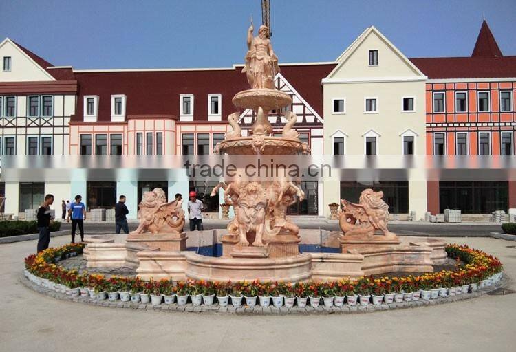 Large pink marble water fountain with poseidon and horses