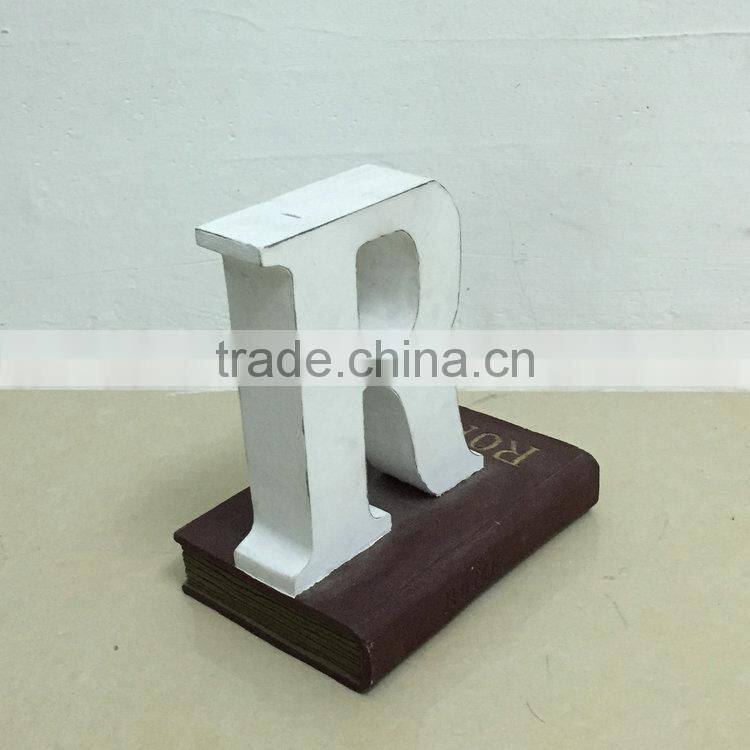 Polyresin book with letter figure