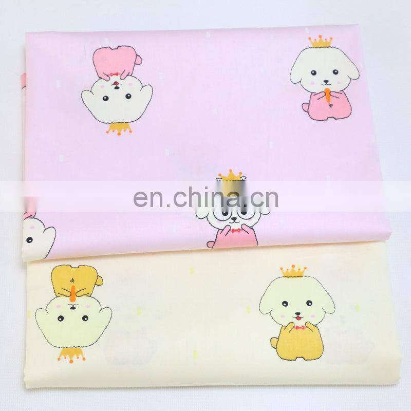 Kindergarten baby cloth cartoon dog crown printed cotton twill fabric environment-friendly printing and dyeing fabric