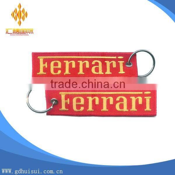 Popular design cheap customized elliptical shape embroidery personalized logo key chain