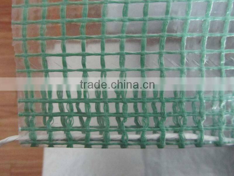Strong clear or green mesh tarpaulin sheet used for building trade