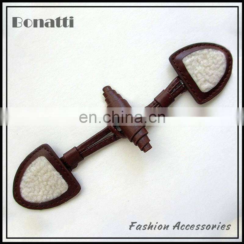 leather toggle button with golden metal buckle