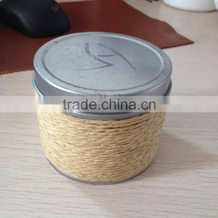 Silvery scented tin candle with string containers