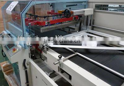 Vertical L type shrink wrapping machine