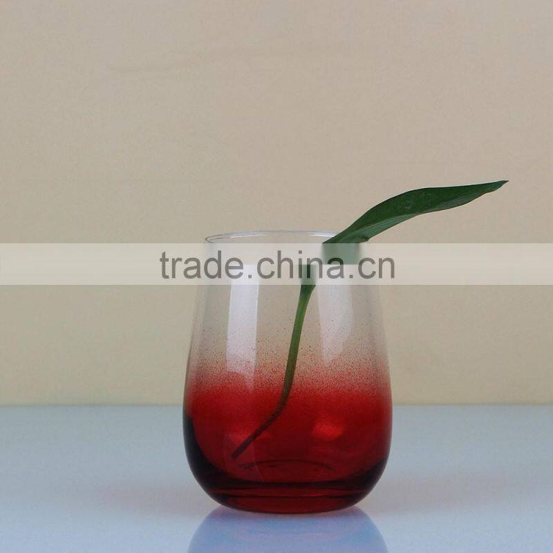Red bottom stemless wine glass