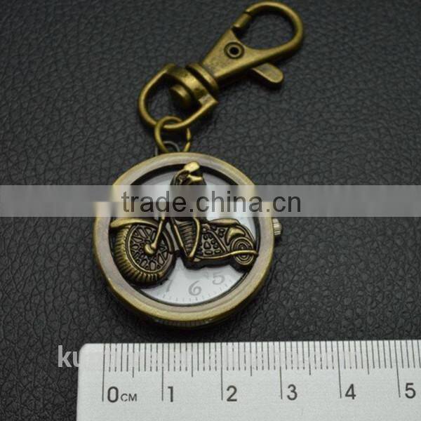Bronze vintage watch with keychain decorate with motorbike