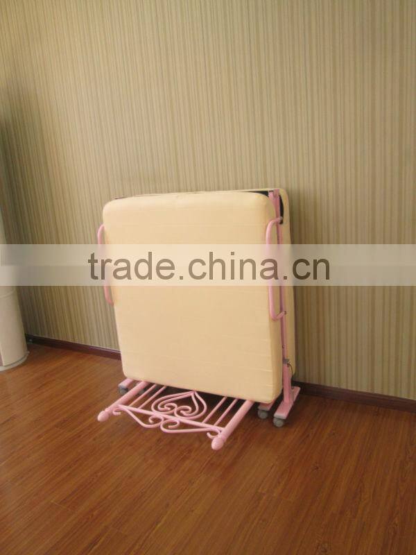 single pink folding metal bed