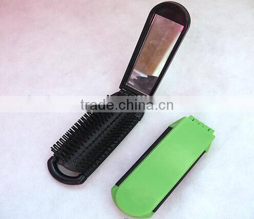 15060312 Plastic pocket mirror with hairbrush