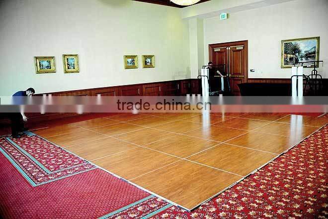 Natural teak wooden dance floor with gold anodized aluminum trim