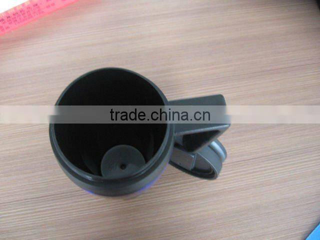 Insulated travel mug with stainless steel ring in middle