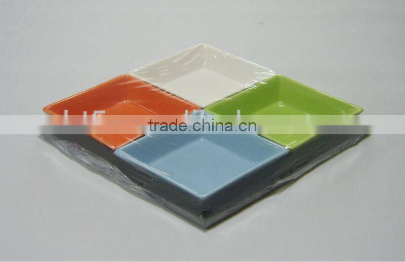 Colorful ceramic snack plates with wooden tray
