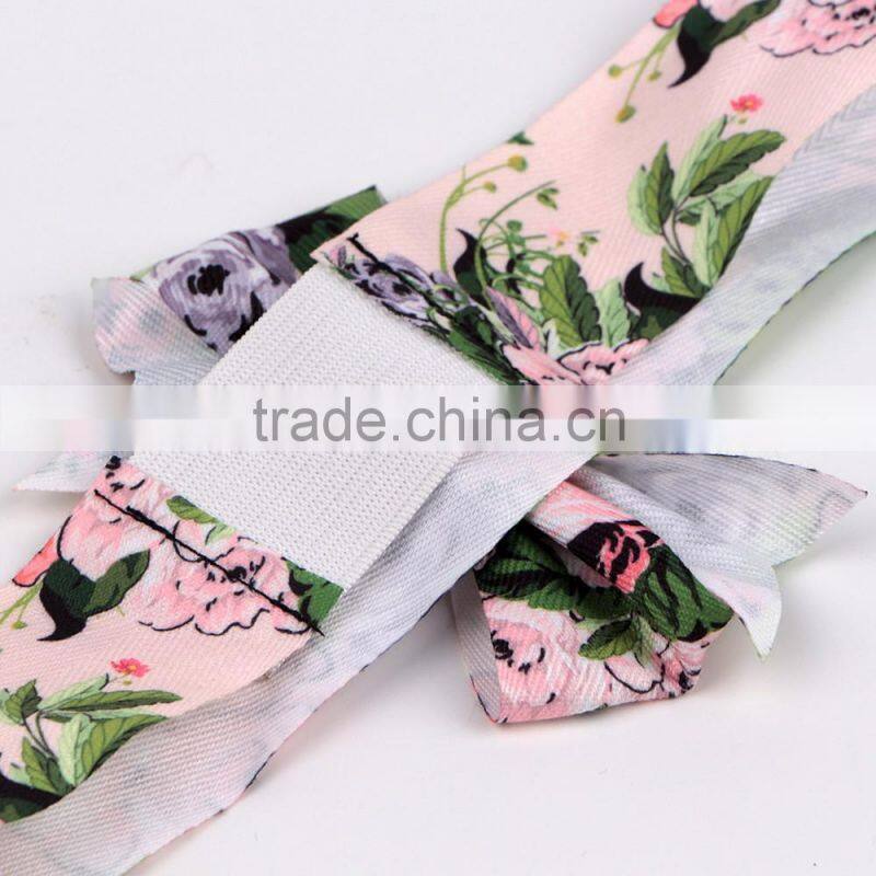 Red christmas ribbon bow with adhesive tape