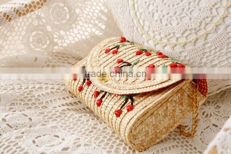 straw clutch bag with cherry pattern, gold chain cross body