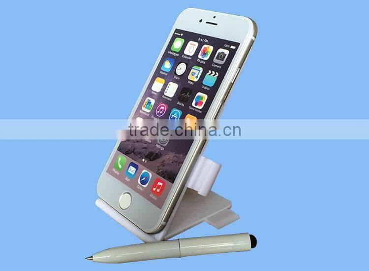 Multifunctional sticker with pen/mobile phone holder