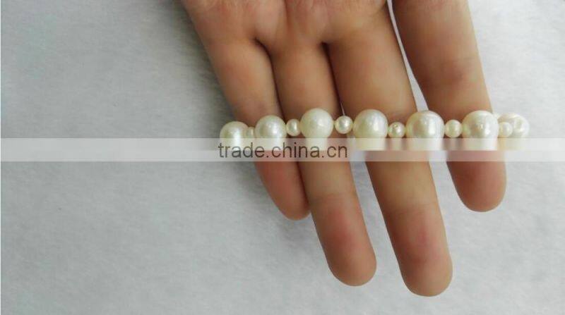 AA 8mm white with 2mm white round freshwater pearl bracelet