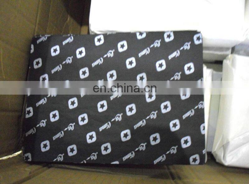 White tissue paper with red logo