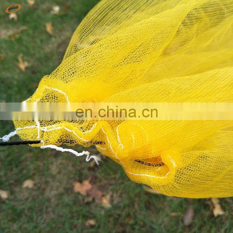 plastic mesh bag for harvesting the dates and the mangos