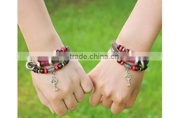 >>best selling multi layered key Charms bracelet, braided leather bracelet /