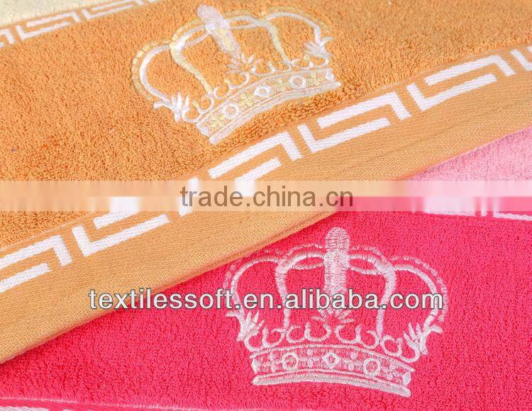 cheap100%cotton terry solid embroidery crown border towel