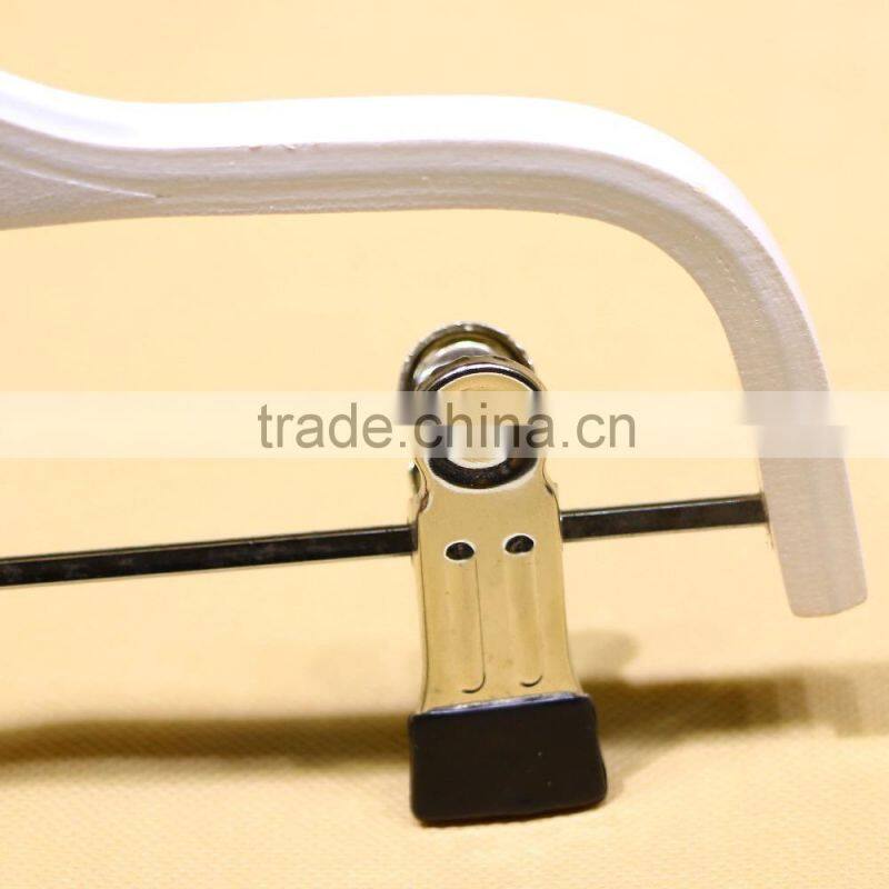 White wooden pants hanger for children garment