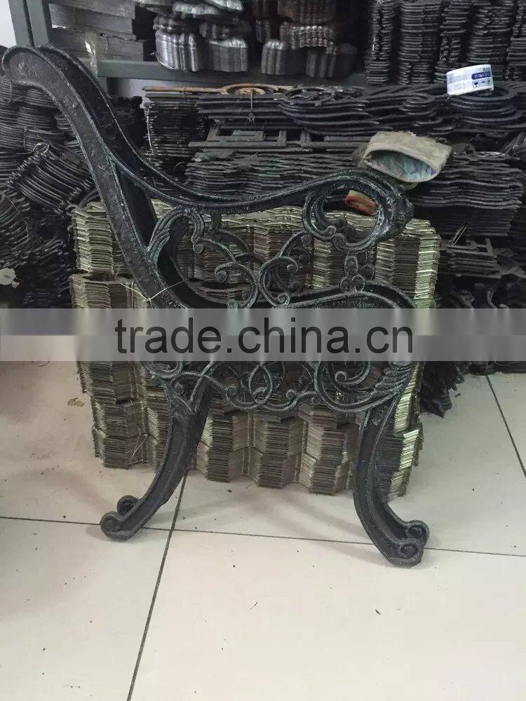 Iron legs of street wooden iron bench, antique park bench