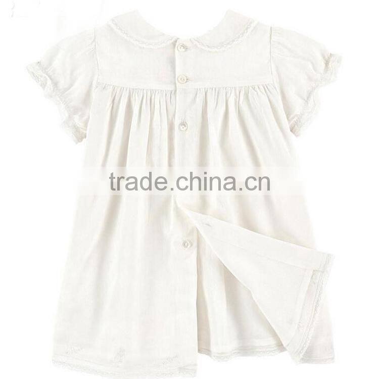 Toddler girl's smocked white dress with collar design