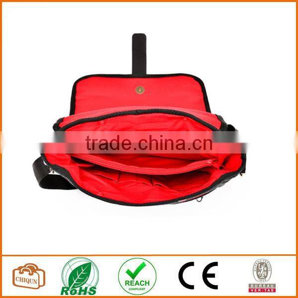 Unisex messenger bag and backpack. Grey Wool-Polyester mix with red details and lining. Multiple pockets