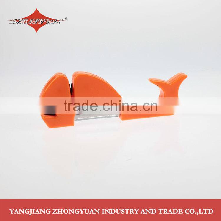 Whale shaped knife sharpener with plastic grip