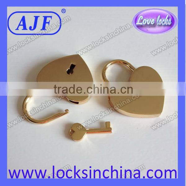 Heart shaped lock and key with gold color