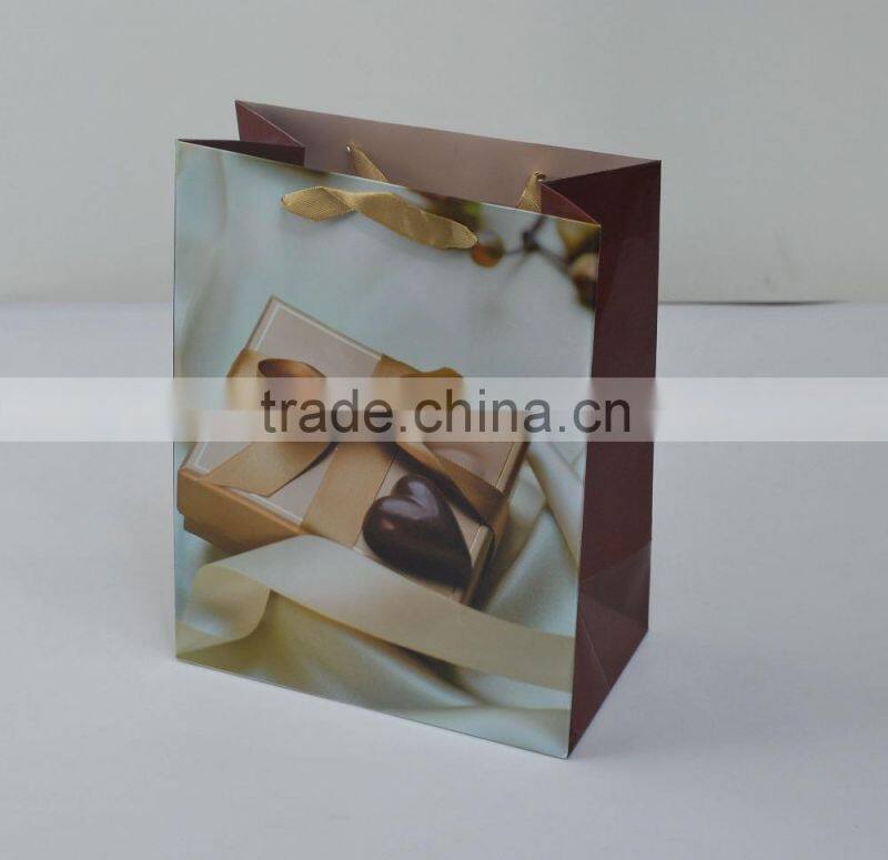 Custom red heart style paper bag for packing small gifts with ribbon handle made in china supplier and manufacture