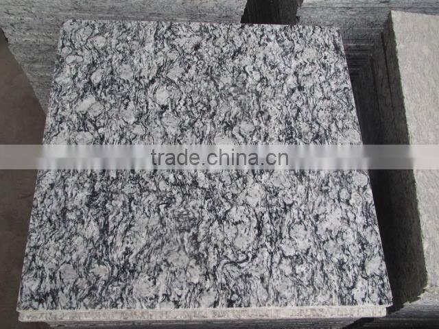 China spray white granite tile prices