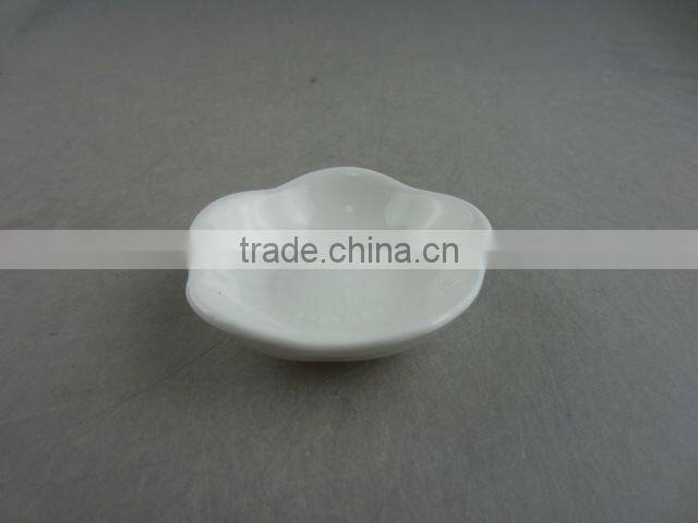 white porcelain flower-shaped dish
