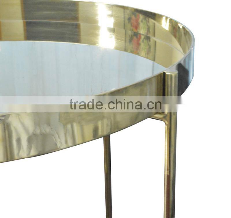 Golden stainless steel round coffee table