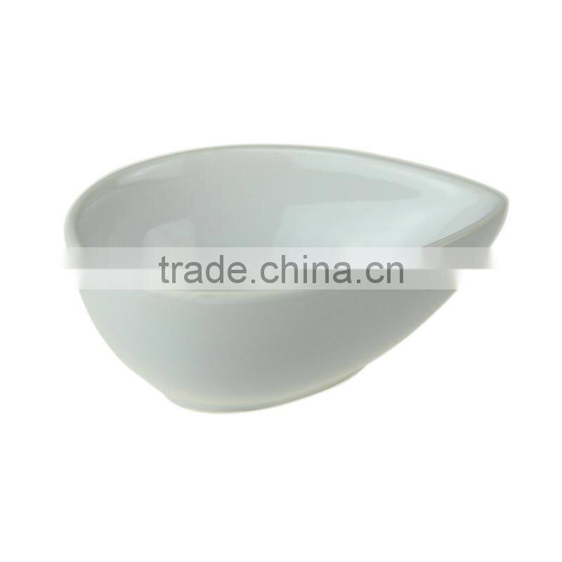 beige glazed ceramic salad bowl in water drop shape