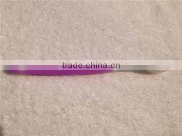 Personalized purple plastic toothbrush with rubber handle for adult