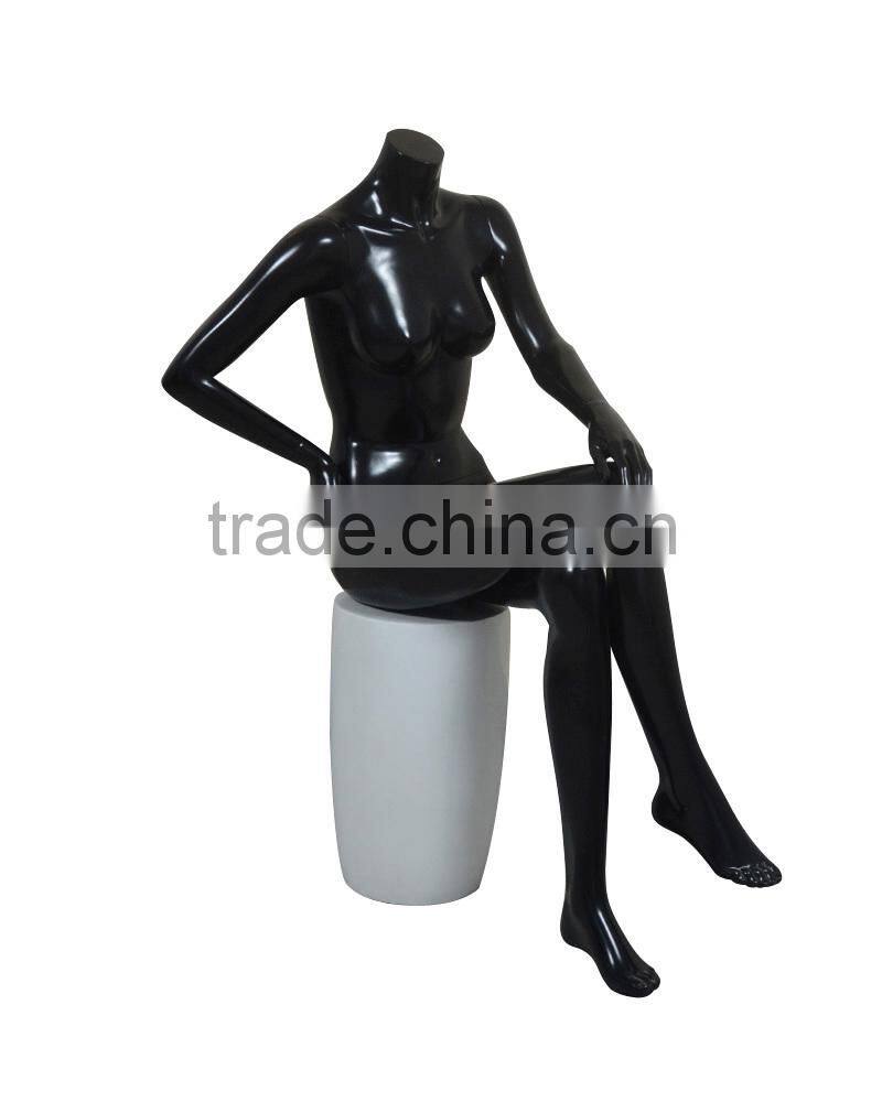 Sitting headless sexy female mannequin