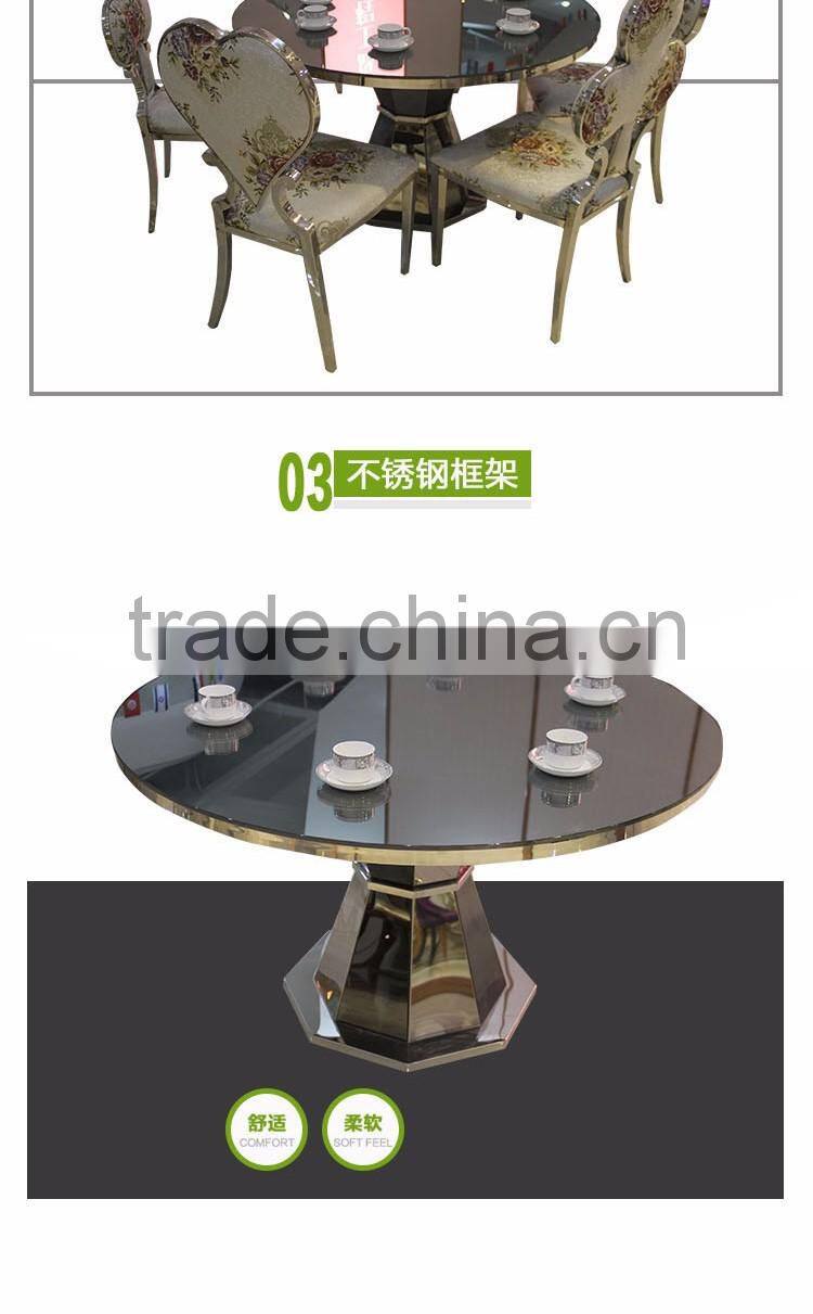 Upholstered stainless steel goldedn glass surface table for sale