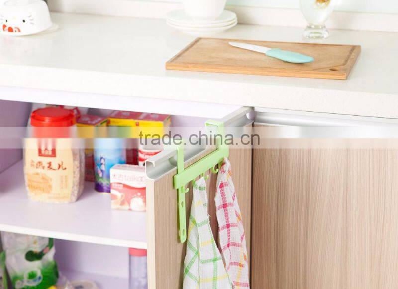 Multipurposed pothook behind the kitchen door