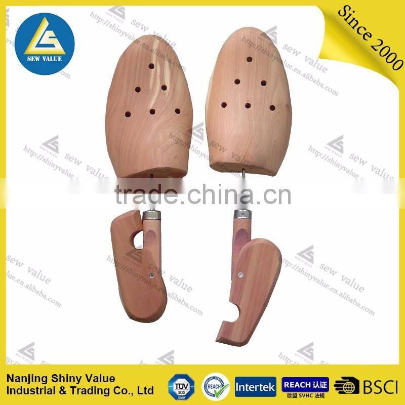 Twistable wooden type aromatic red cedar wood shoe tree with holes in the front part